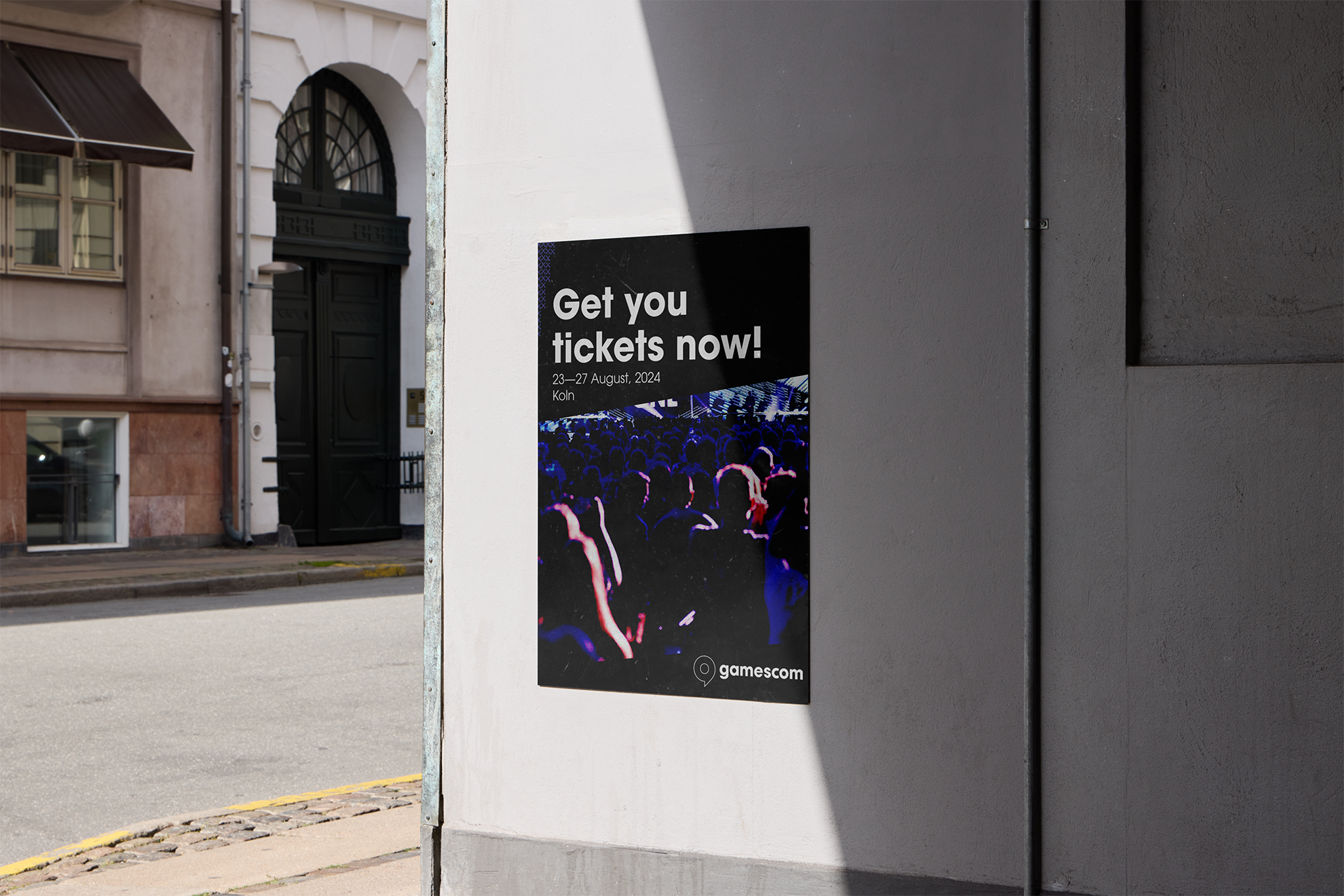 Gamescom promotional poster — printed mockup on a city wall